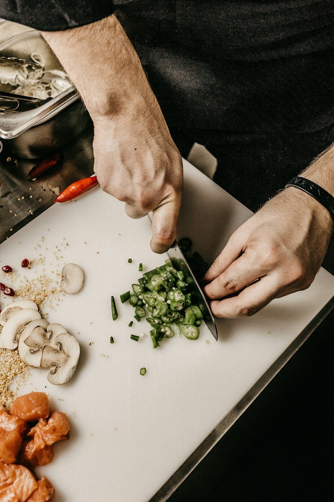 person chopping vegetables quickly